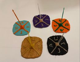 5 dreidel bases with picks attached