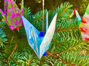 Crane Ornament On Pine Tree